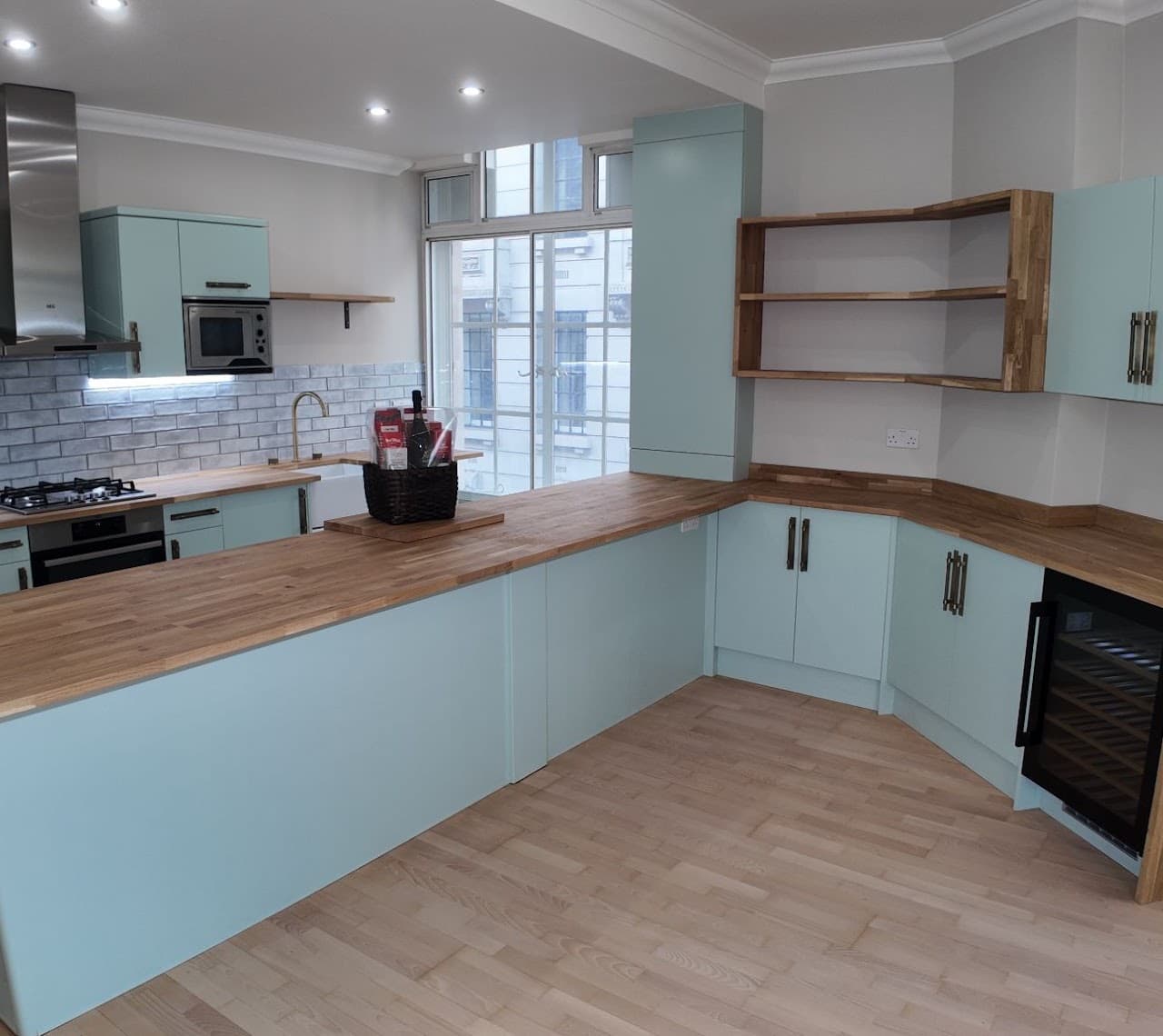 Our team installing a bespoke kitchen with integrated appliances